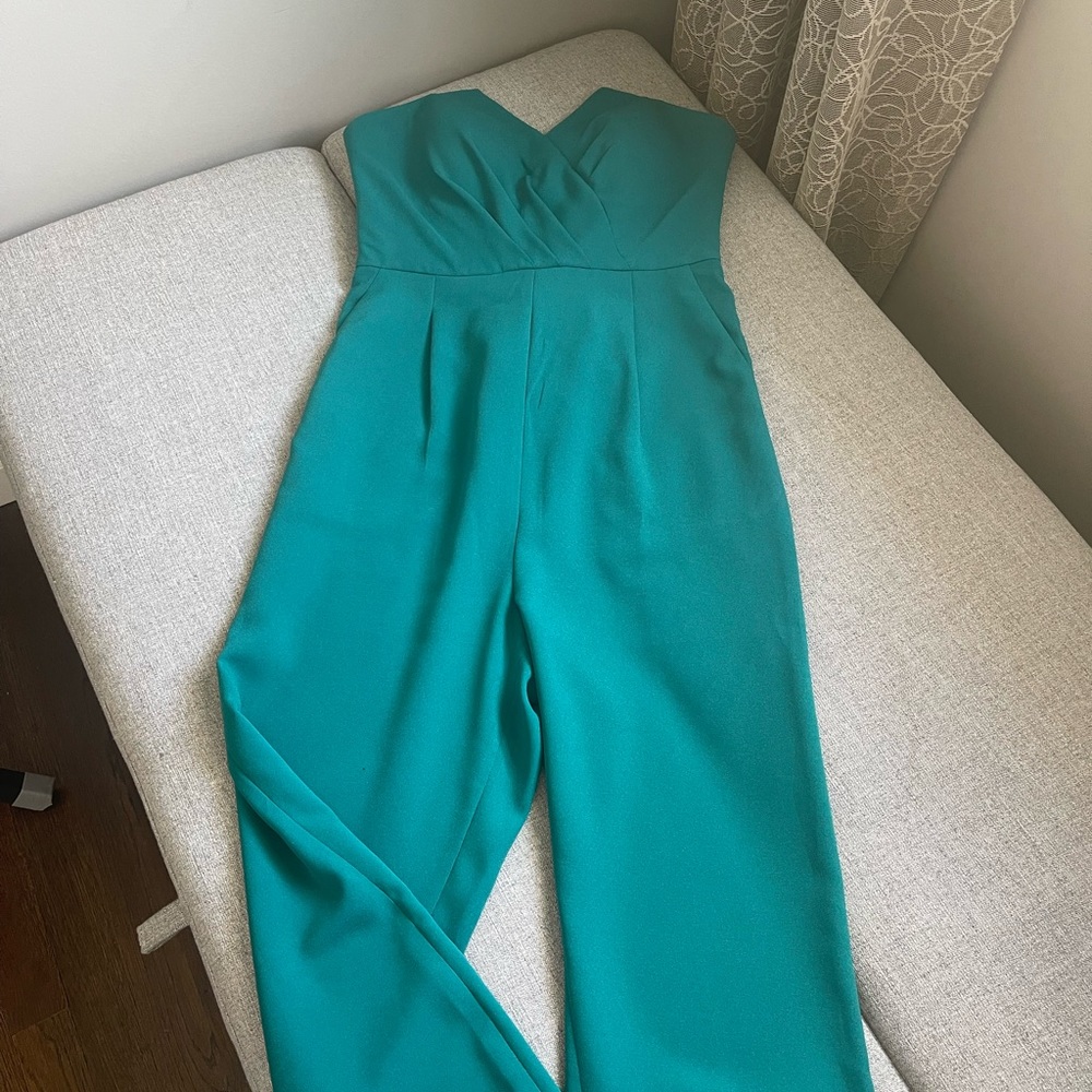 Bebe jumpsuit size 2 in good condition